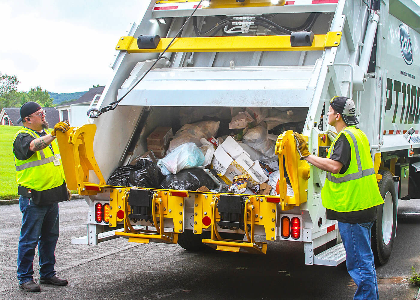 Commercial rearload garbage trucks with container lift