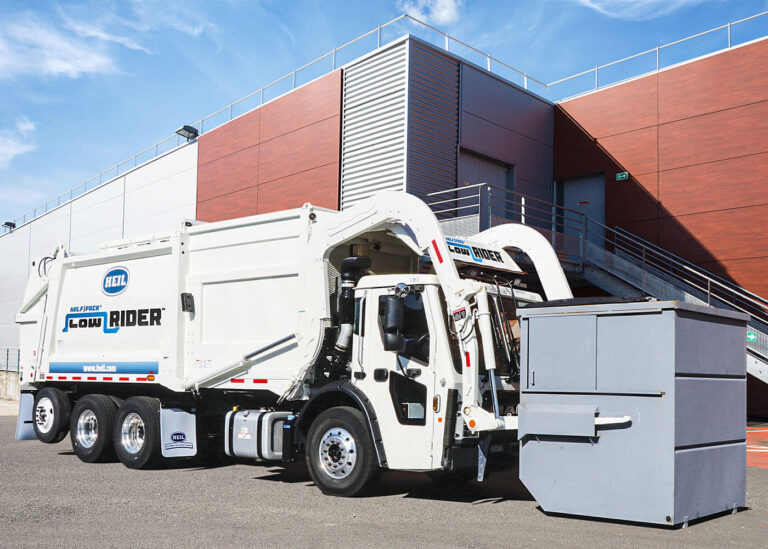 Low profile garbage truck for residential or commercial trash collection