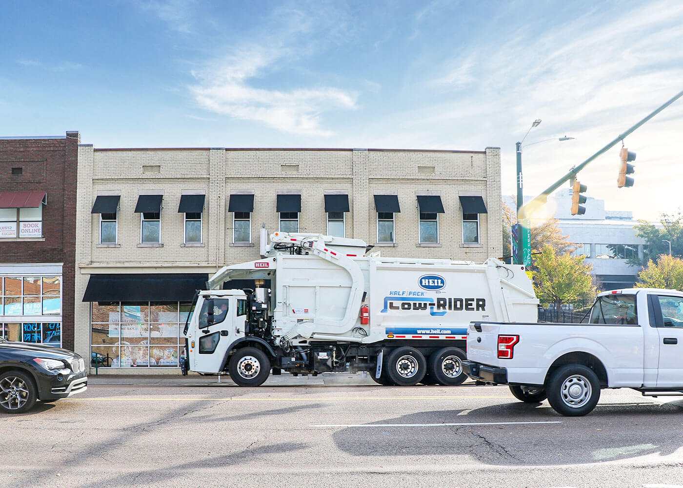 Low Profile Automated frontload trash trucks for large capacity residential trash collection