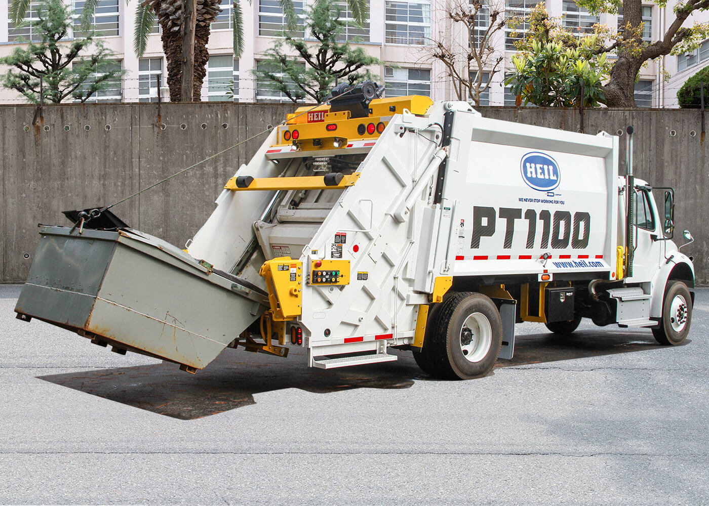 PT1100 Rearloader for picking up commercial rear load garbage dumpster containers