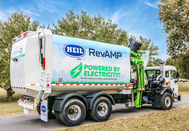 Electric sideloader garbage truck on route