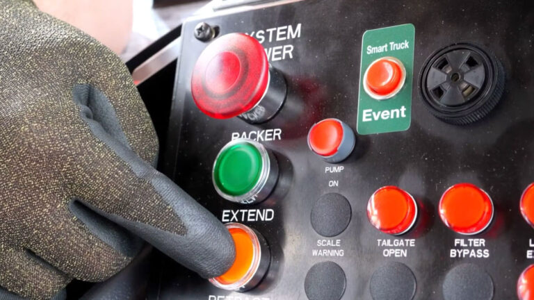 Heil automated side load garbage truck packing features video